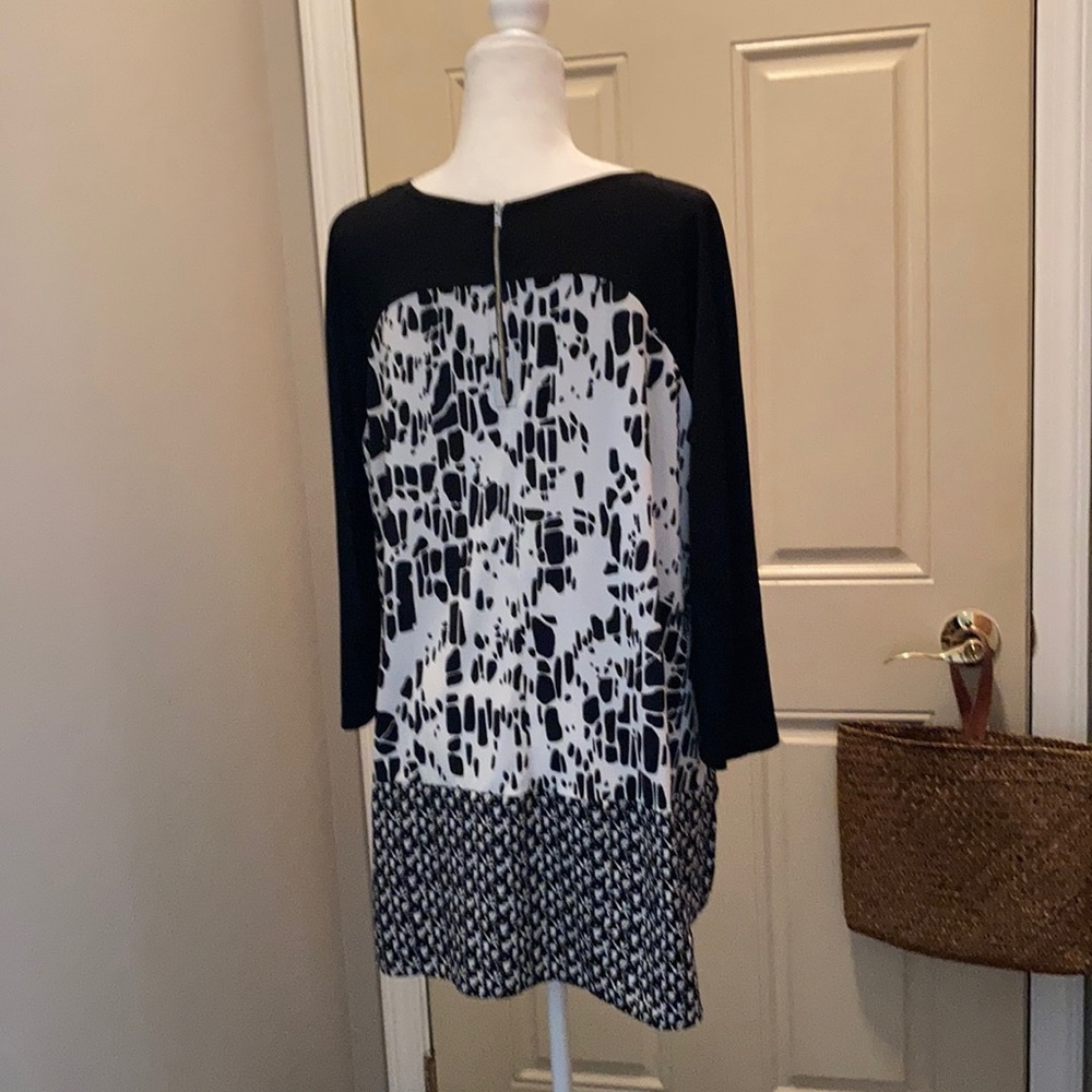 Blouse- zippered back detail.